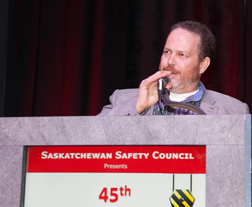 Jason Davidson, PCL Construction Management Inc., makes a few remarks after having been named Safety Professional of the Year at the Industrial Safety Seminar.